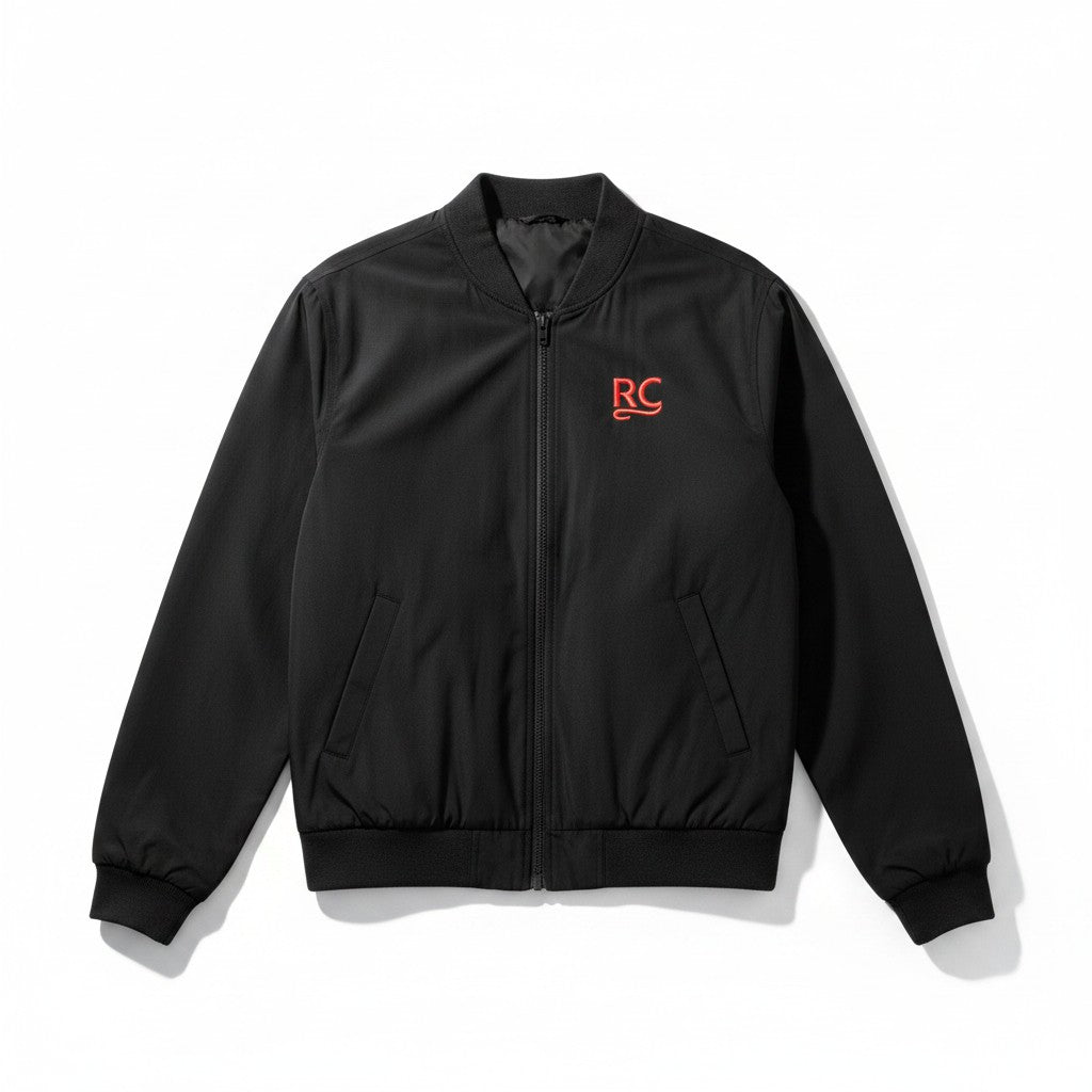 The RevenueCat Swag Store black lightweight bomber jacket with a full-zip front and red embroidered RC logo on chest.
