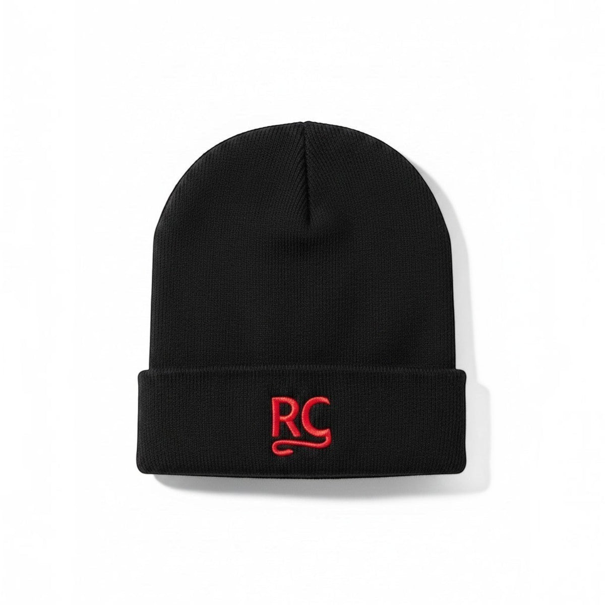 The RevenueCat Swag Store black cuffed knit beanie with a red embroidered RC logo on the front.