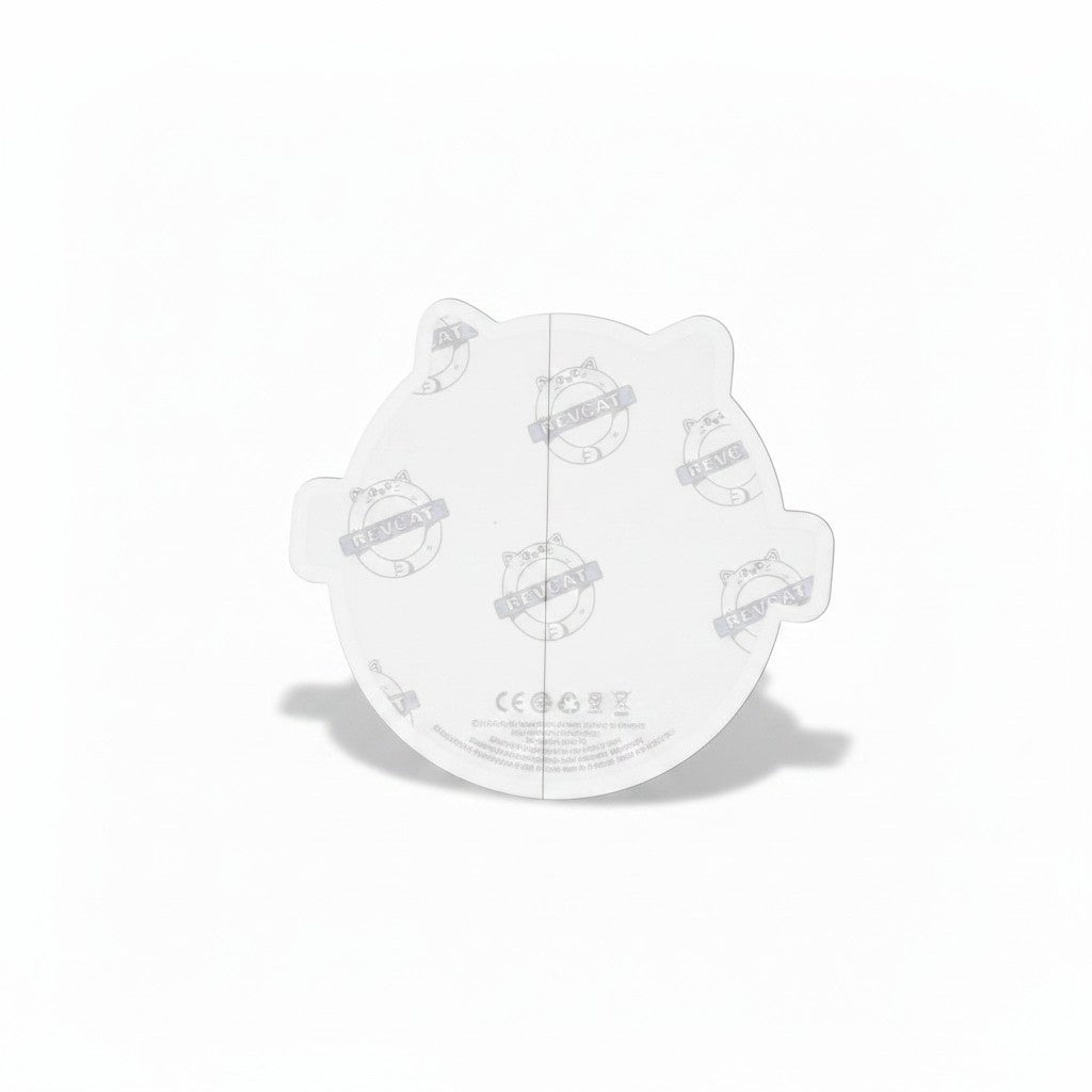 The RevenueCat Swag Store round cat vinyl sticker back view showing the protective paper backing with logo pattern.