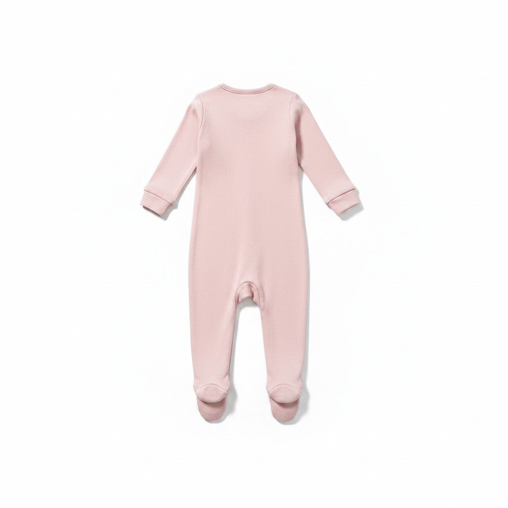 The RevenueCat Swag Store blush pink infant footed one-piece pajama with long sleeves and ribbed cuffs, back view.
