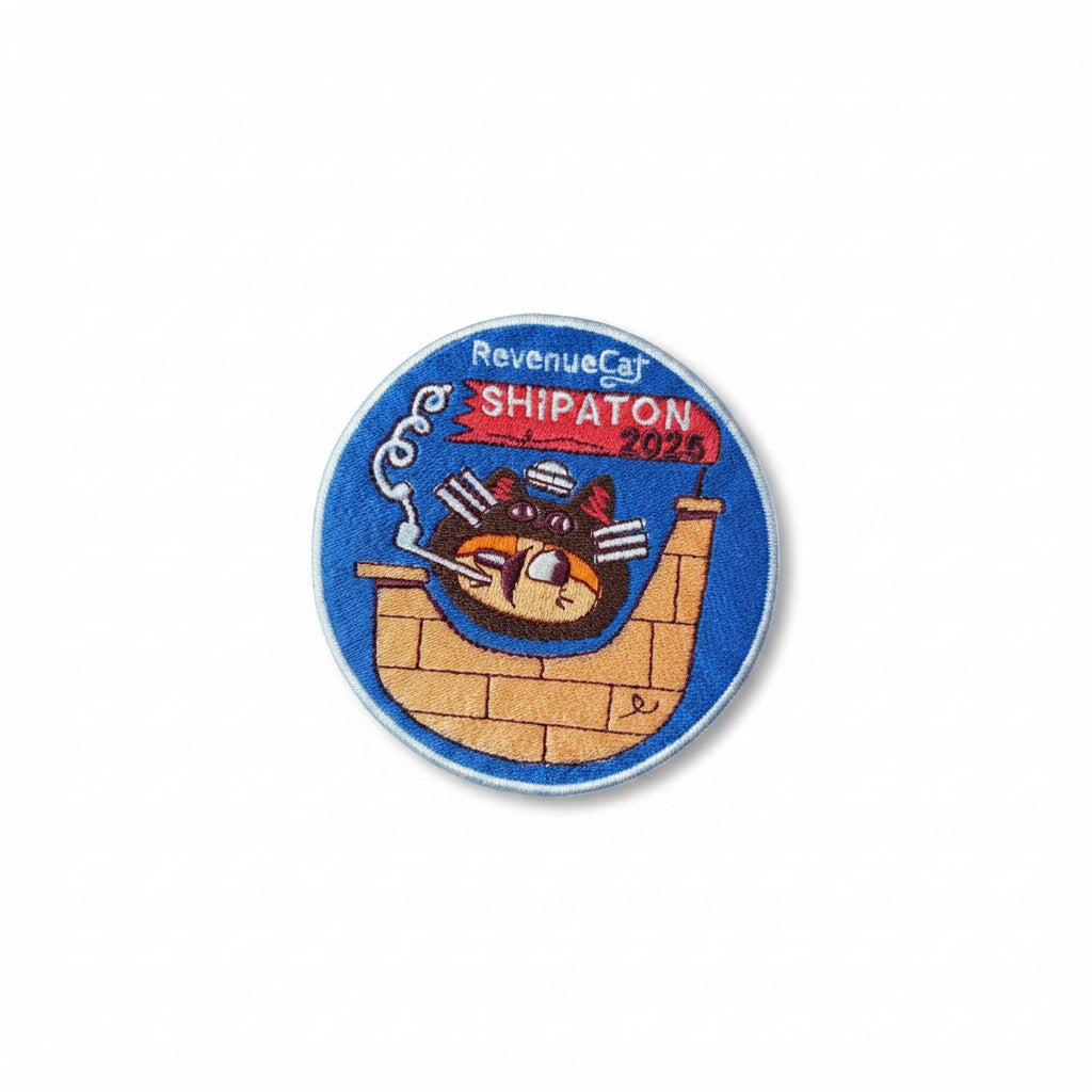 The RevenueCat Swag Store circular embroidered patch featuring a cat captaining a ship for the 2025 Shipaton event.